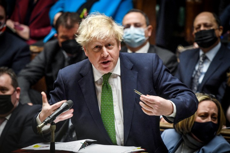 Image: British PM Johnson speaks during the weekly question time debate at Parliament in London