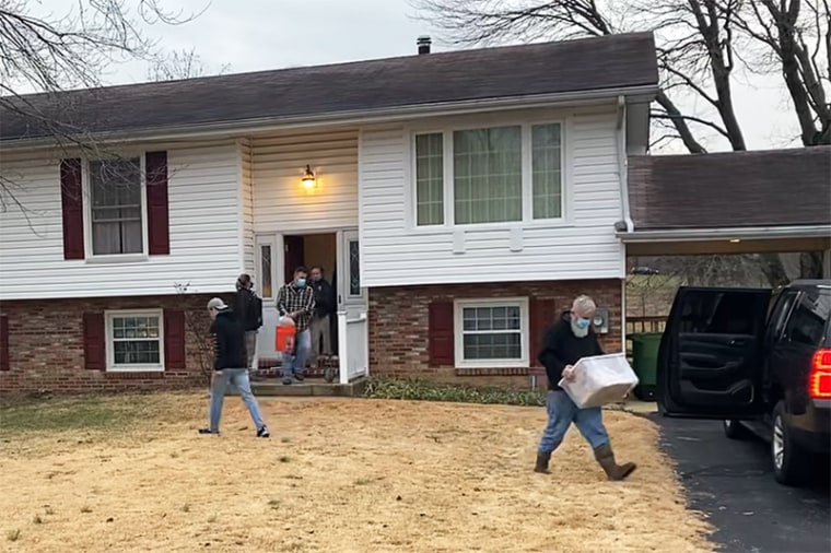 Image: Officials remove snakes from a home in Maryland.