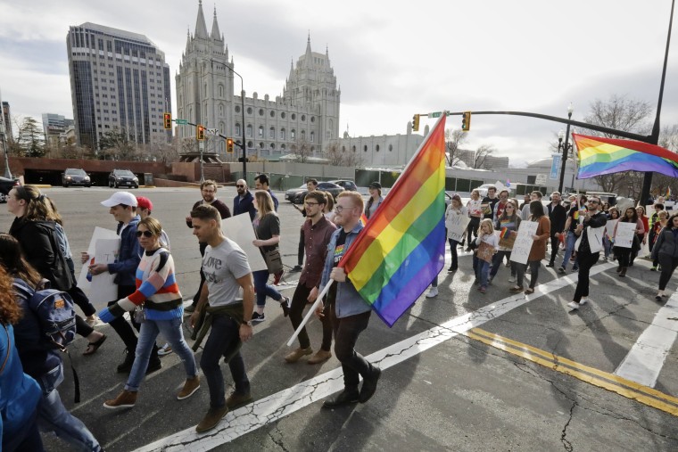 Several hundred Brigham Young University students march near The Church of Jesus Christ of Latter Day Saints church headquarters on March 6, 2020, in Salt Lake City, to protest a letter that clarified that "same-sex romantic behavior" is not allowed on campus.