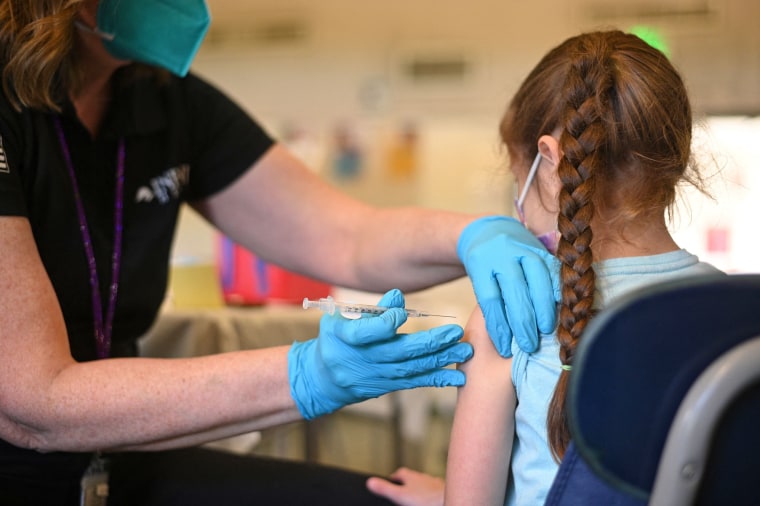 A nurse administers a pediatric dose of the Covid-19 vaccine