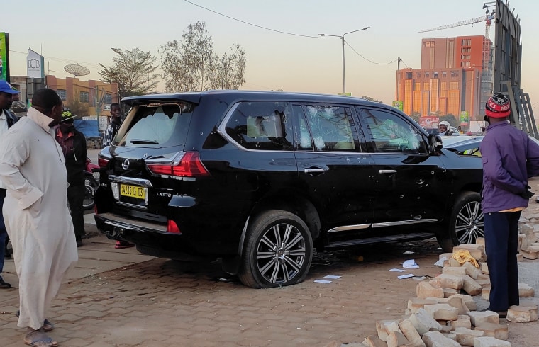 Image: Bullet holes are seen in a car that belong to presidency  following heavy gunfire near the president Roch Kabore residence  in Ouagadougou