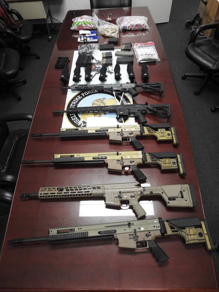 High-powered firearms and ammunition in an undated photo provided by the Justice Department.