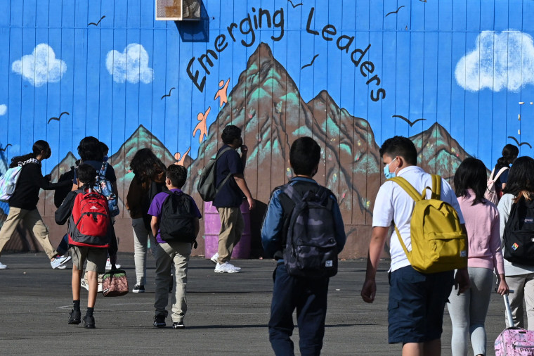 Students walk to their classrooms at a public middle school in Los Angeles on Sept. 10, 2021.