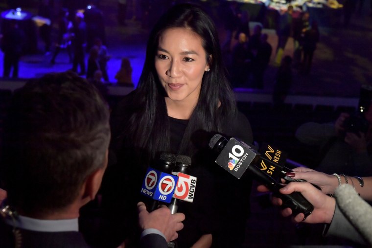 Image: Michelle Kwan speaks to the media before receiving a lifetime achievement award at The Sports Museum's Annual Gala in 2019.