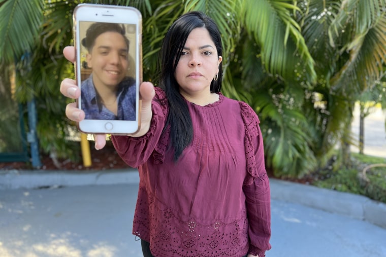 Venezuelan immigrant Carolina Estrada shows a photo of her son Ricardo, 22, the only member of the family to be deported by ICE after requesting asylum.