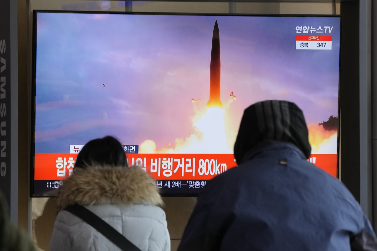 People watch a TV showing a file image of North Korea's missile launch during a news program at the Seoul Railway Station in Seoul, South Korea, Sunday, Jan. 30, 2022.