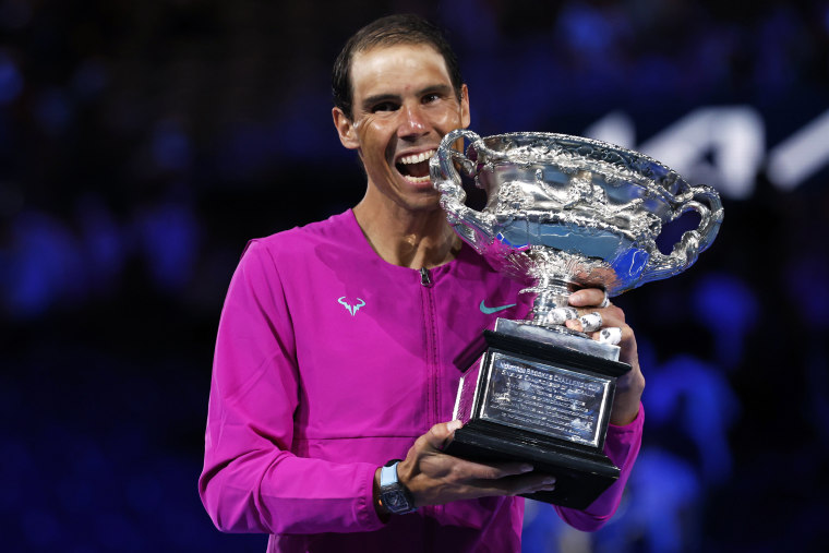 Rafael Nadal holds the Norman Brookes Challenge Cup after defeating Daniil Medvedev in the men's singles final at the Australian Open tennis championships in Melbourne, on Jan. 31, 2022.