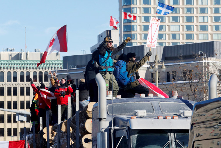 Image: Truckers take part in a convoy and protest against COVID-19 vaccine mandate in Ottawa