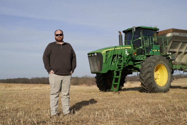 Jared Wilson with his John Deere tractor.