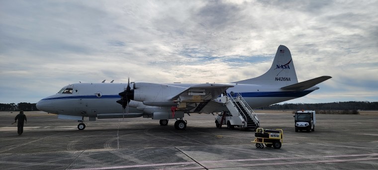 A NASA P-3 Orion getting ready to depart Wallops to avoid the storm that the aircraft is going to fly into the next day.