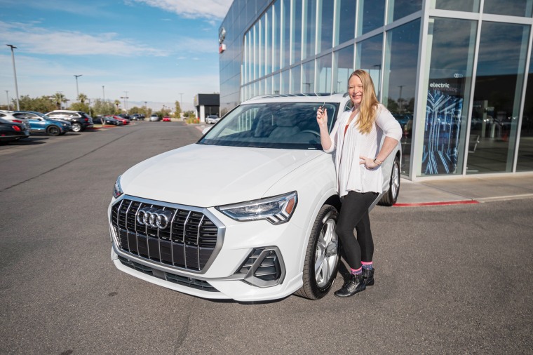 Rubush poses with her new Audi.