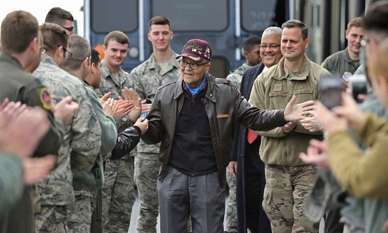 Retired U.S. Air Force Col. Charles McGee, center, receives a congratulatory send-off after visiting with 436 Aerial Port Squadron personnel at Dover Air Force Base to help celebrate his 100th birthday in Dover, Delaware, Friday, Dec. 6, 2019. 