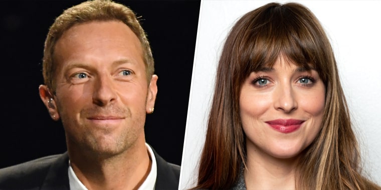 Chris Martin (L) helps girlfriend Dakota Johnson with Zoom when she failed to get into a video chat for the 2022 Sundance Film Festival.