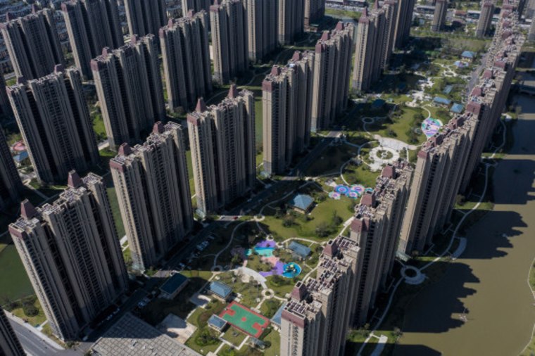 Evergrande Group is one of China’s biggest builders of apartments, office towers and shopping malls. (Qilai Shen / Bloomberg via Getty Images)