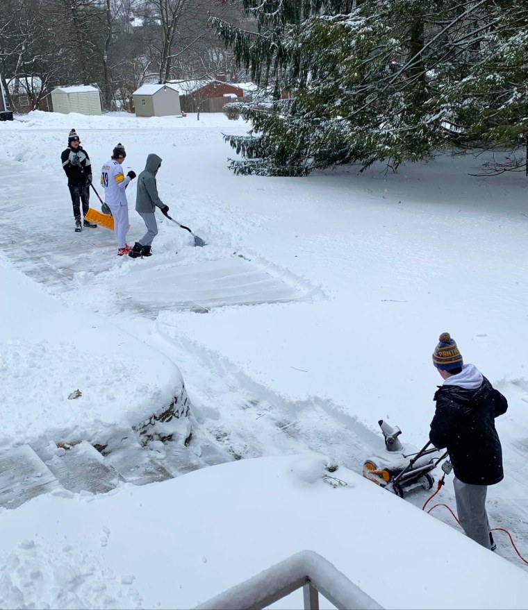 Around 40 football players headed into their Pittsburgh community to help neighbors shovel out from a winter storm.