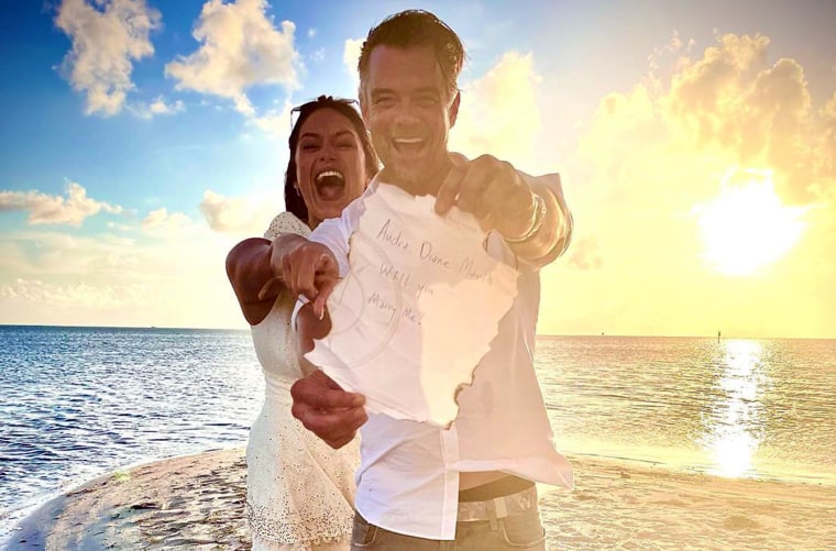 The happy couple announced their engagement in an excited beach photo.