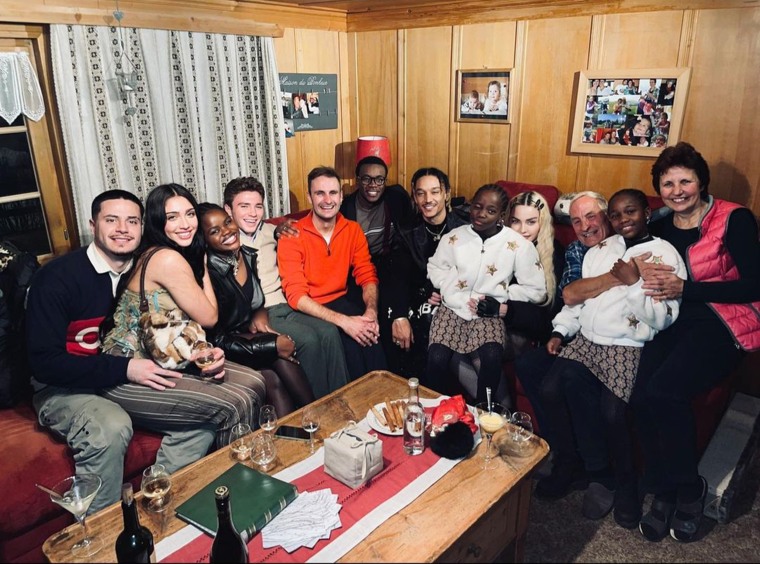 Madonna shares a rare photo of herself alongside all six of her children, as well as other friends. 