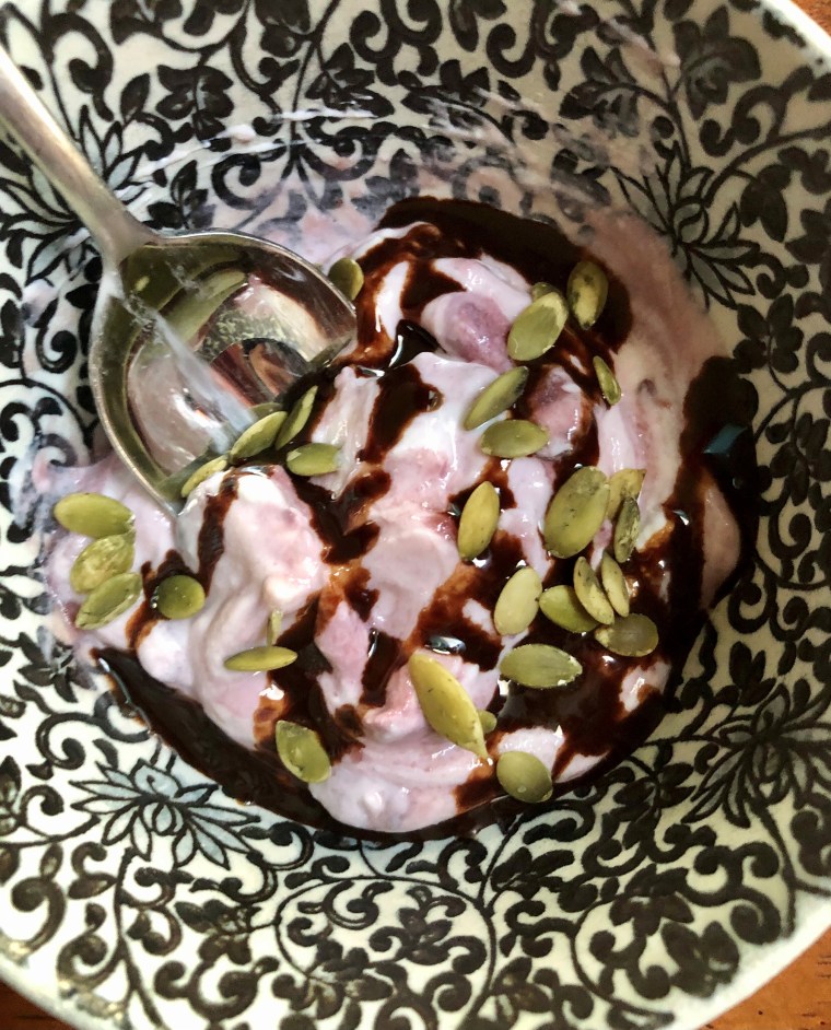 Chobani cherry Greek yogurt with Go Raw pumpkin seeds and a little Hershey’s Simple Chocolate Syrup.
