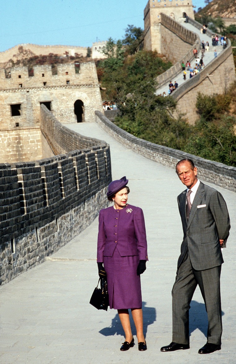 Queen And Philip stand on the Great Wall Of China.