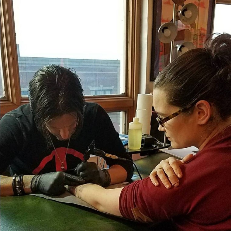 Kate Mervine, getting inked.