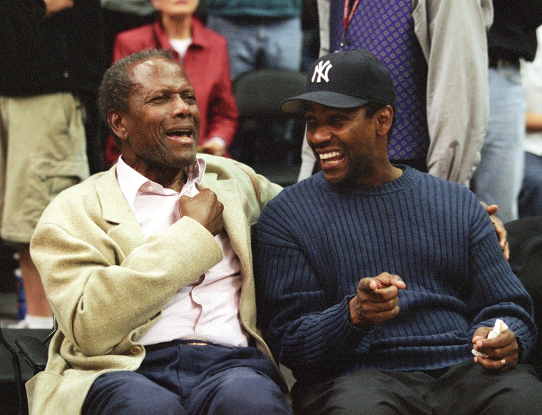 Sidney and Denzel at Game Two of the NBA Playoff with the Los Angeles Lakers