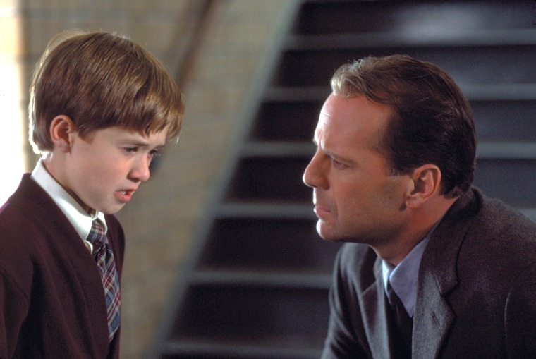 Haley Joel Osment as Cole Sear and Bruce Willis as Malcolm Crowe star in the mystery-drama- thriller The Sixth Sense.