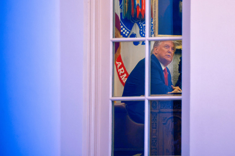 Image: President Donald Trump sits at his desk in the Oval Office of the White House on Nov. 13, 2020.