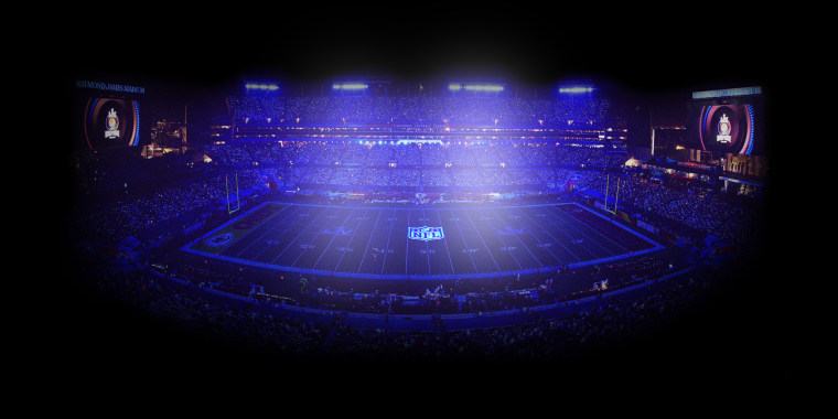 Photo Illustration: An empty football field illuminated by lights