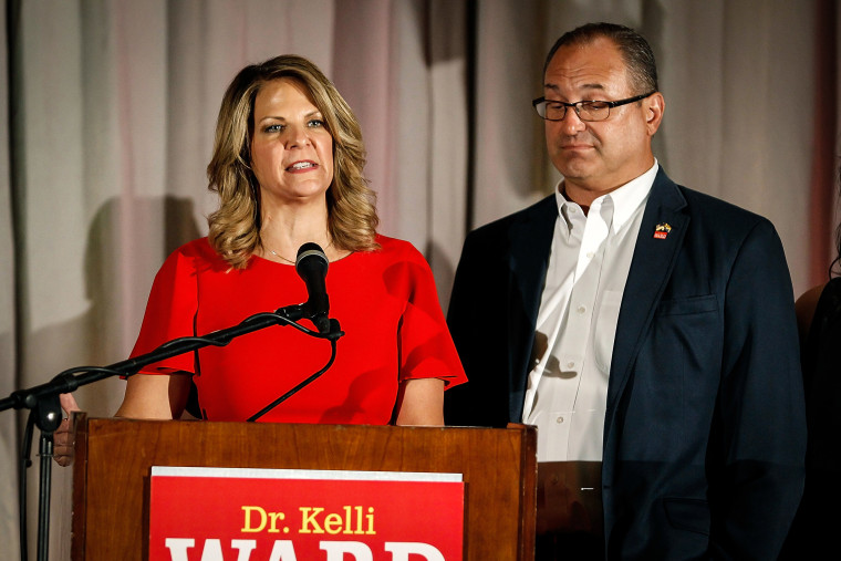 Arizona GOP senate candidate Kelli Ward, with husband Michael Ward by her side, concedes the primary in a speech to supporters at an election night event on Aug. 28, 2018 in Scottsdale, Ariz.