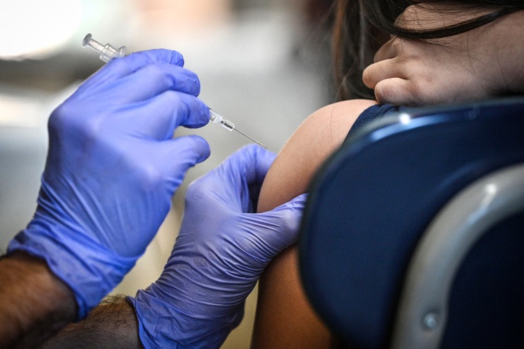 A nurse prepares to administer a pediatric dose of Covid-19 vaccine at Los Angeles Mission College in the Sylmar neighborhood of Los Angeles, on Jan. 19, 2022.