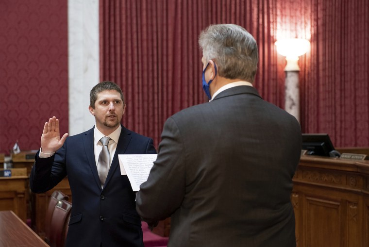 West Virginia House of Delegates member Derrick Evans is given the oath of office Dec. 14, 2020, at the state Capitol in Charleston, W.Va.