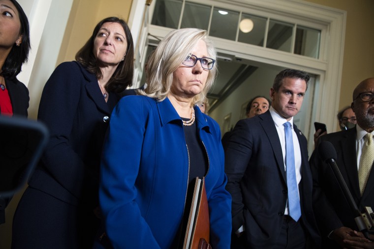 Reps. Liz Cheney, R-Wyo., center, and Adam Kinzinger, R-Ill., center right, address the media after a hearing of the House Jan. 6 committee on July 27.
