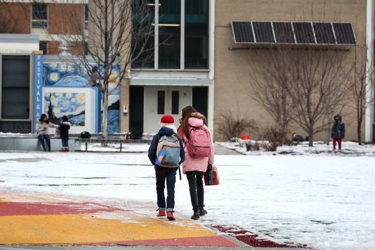 Students arrive for classes at A. N. Pritzker elementary school on Jan. 12, 2022 in Chicago.