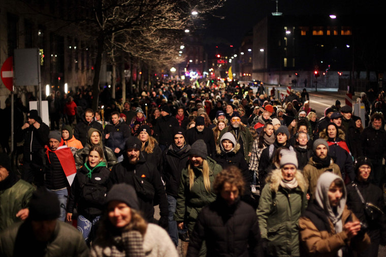 Image: Demonstrators march against Covid-19 restrictions in Copenhagen, Denmark, on Jan. 9, 2022.