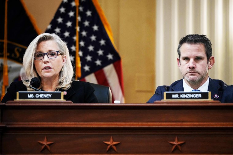 Reps. Liz Cheney, R-Wyo., and Adam Kinzinger, R-Ill., listen during a select committee investigating the attack on the Capitol on Dec. 1, 2021.