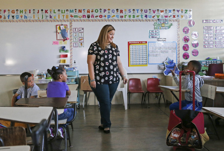First grade teacher Karen Aviles talks to her students at the Julio Selles Sola Elementary School during the aftermath of Hurricane Maria in Rio Piedras a neighborhood of San Juan, Puerto Rico, on Oct. 24, 2017.