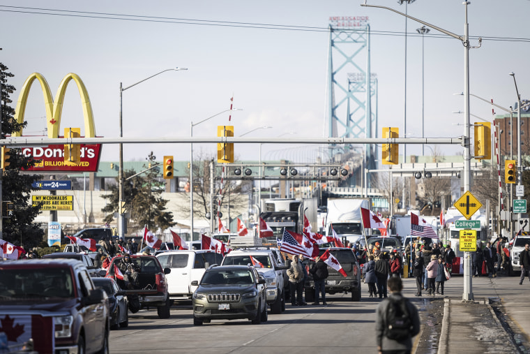 Image: Protestors block traffic at the Ambassador Bridge, linking Windsor, Ontario and Detroit on Feb. 9, 2022.