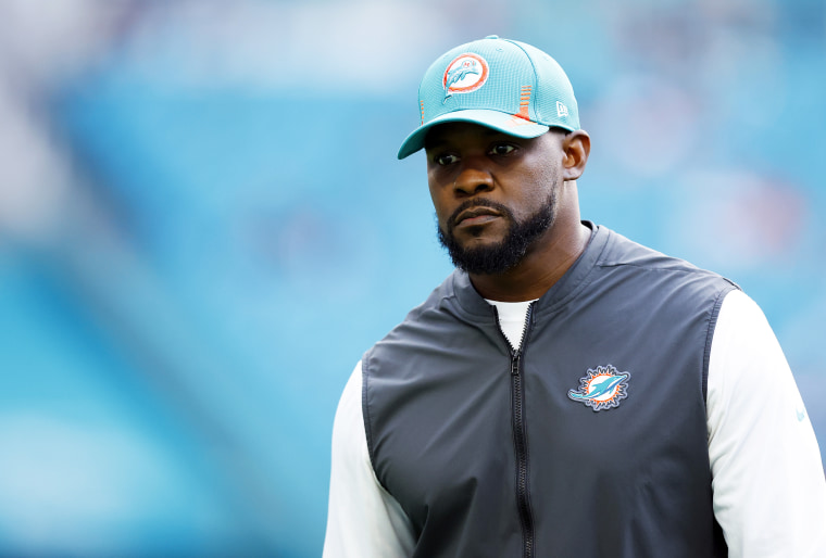 Miami Dolphins head coach Brian Flores walks the field prior to the game against the New England Patriots on Jan. 9, 2022, in Miami Gardens, Fla.