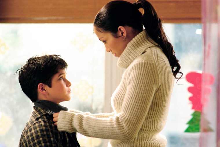 Tyler Posey and Jennifer Lopez, in "Maid in Manhattan" in 2002.