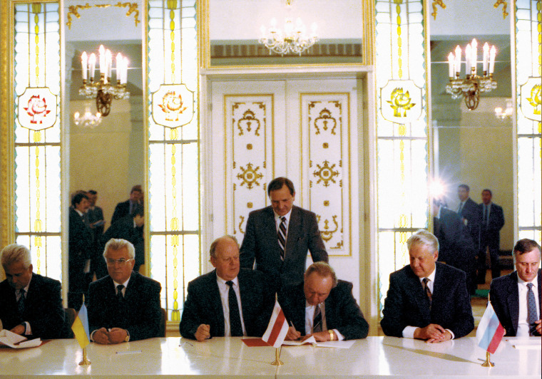 Russian President Boris Yeltsin, second right, Ukrainian President Leonid Kravchuk, second left, and Belarussian leader Stanislav Shushkevich, third left, sign an agreement terminating the Soviet Union in Viskuli, Belarus, in December 1991. 