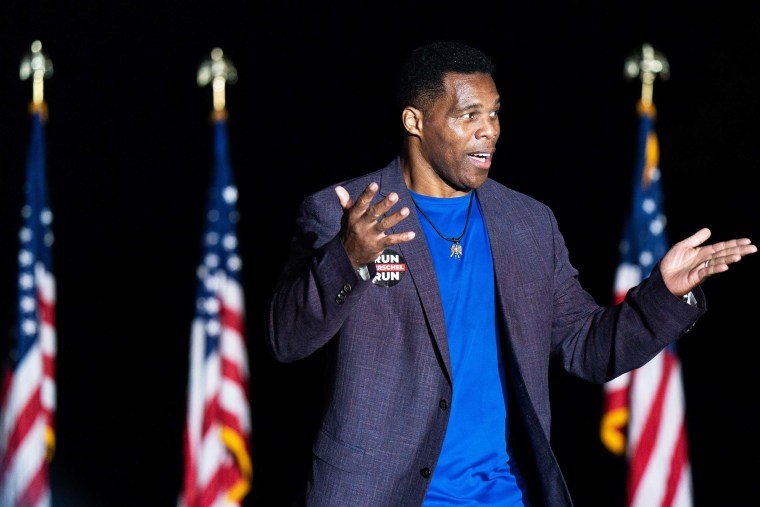 Republican Senate candidate Herschel Walker greets the crowd during a rally with former President Donald Trump on September 25, 2021 in Perry, Georgia.