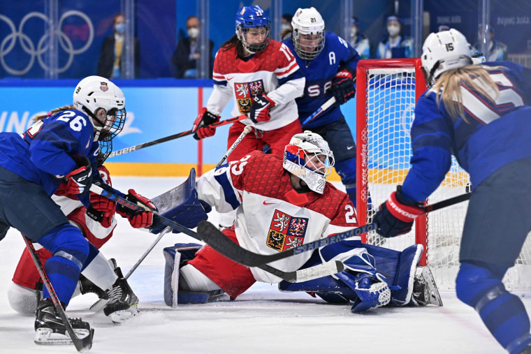 USA's Savannah Harmon, right, shoots to score a goal past the Czech Republic's goaltender Klara Peslarova during the women's play-offs quarterfinals match of the 2022 Beijing 2022 Winter Olympics on Feb. 11, 2022.