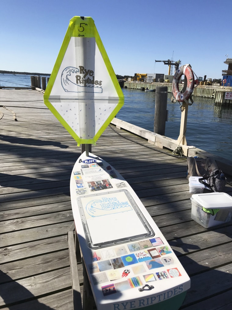 The miniature boat built by junior high school students in Rye, N.H., sits on a dock, Oct. 9, 2020, in Woods Hole, Mass. The boat, containing photos, fall leaves, acorns and state quarters, was launched in the Gulf Stream in October 2020 by SSV Corwith Cramer and was eventually found by a Norwegian school student after it washed ashore in Norway on Feb. 1, 2022.