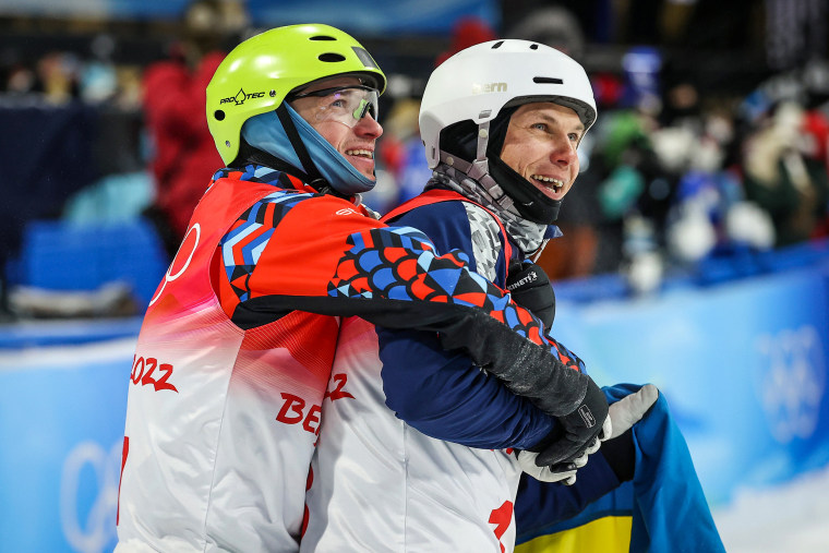 Image: Bronze medallist Ilia Burov of Team ROC, left, and Silver medalist Oleksandr Abramenko of Team Ukraine during the Men's Freestyle Skiing Aerials Final on Day 12 of the Beijing 2022 Winter Olympics at Genting Snow Park on Feb. 16, 2022 in Zhangjiakou, China.