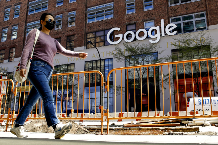 A woman walks near a Google Corporate Office on April 13, 2021 in New York.