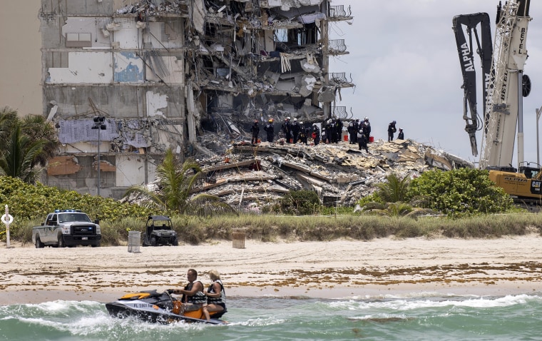 Image: The South Florida Urban Search and Rescue team look for survivors in the rubble of the partially collapsed Champlain Towers South condo building on June 26, 2021.