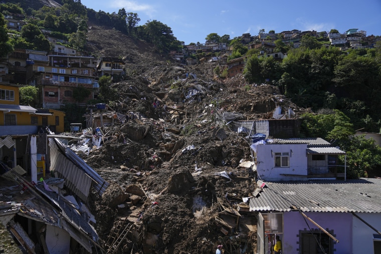 Image: The path of a mudslide marks a hillside filled with homes in Petropolis, Brazil, on Feb. 17, 2022.
