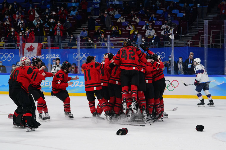 Canada players celebrate after beating the United States to win the women's gold medal hockey game at the 2022 Winter Olympics on Thursday, Feb. 17, 2022, in Beijing.