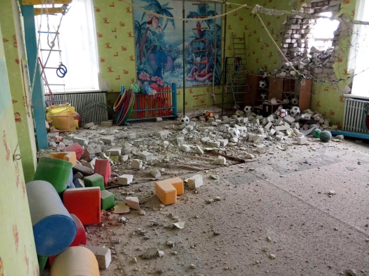 Image: A view shows a damaged kindergarten in Stanytsia Luhanska