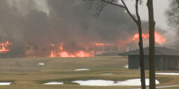 A fire burns at the Oakland Hills country club in suburban Detroit on Feb. 17, 2022.